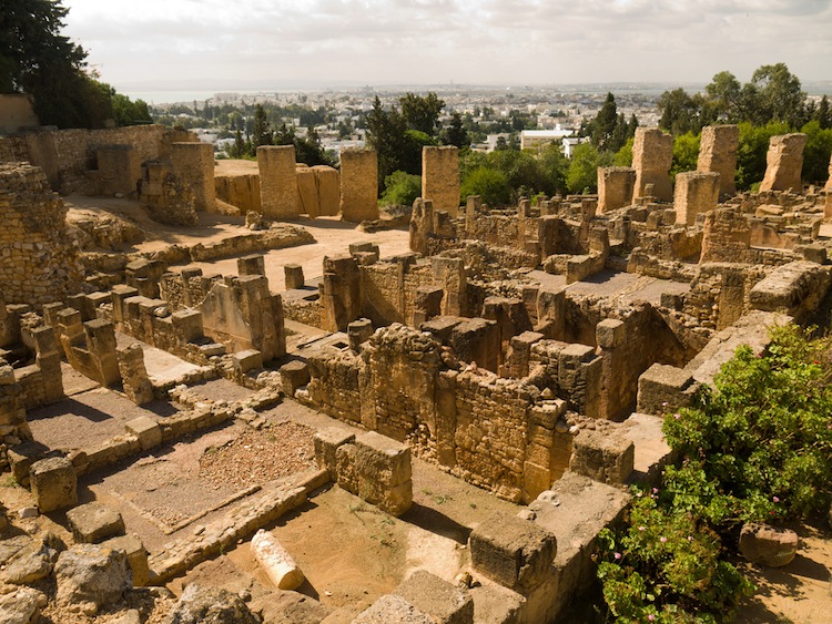 Ruins of Carthage, with modern city on horizon.