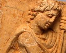 detail of an ivory panel from late antiquity showing the head of a warrior resting on his spear