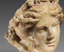marble bust of a young woman, head only