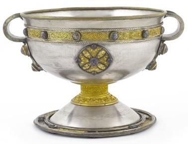 a silver chalice with gold decoration