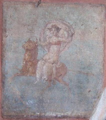 Europa is shown on a blue background seated on a running or leaping bull. The. fabric of her clothing billows out behind her forming a halo.