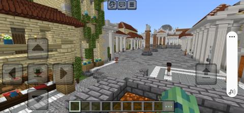 Screenshot from a video game depicting a plaza surrounded by colonnades. Two free-standing brick columns stand in the middle of the plaza with the pediment of a temple or official building behind. Three human figures stand in various locations in the plaza.