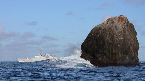 The island of Rockall, with a patrol boat