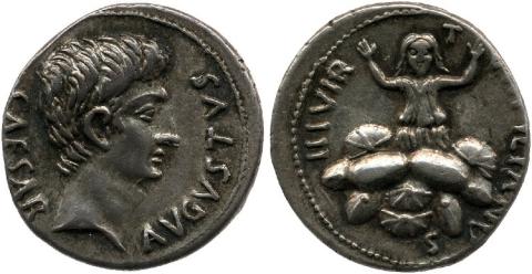 Silver coin featuring August in profile right on the obverse. On reverse Tarpeia facing front both arms raised, her hair loose around her shoulders, a pile of shields in front of her almost as high as her waist.