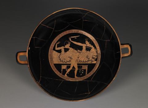 An Athenian drinking cup depicting a symposium scene.
