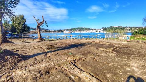 clear archaeological site with sea in the background