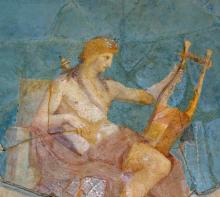 Fresco of Apollo seated facing right. In his left hand he holds a multi-stringed musical instrument called a cithara