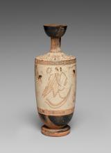 Reddish-brown line-drawing on a white background. Atalanta (center) runs away from Eros (left). She looks back over her shoulder at him, her right arm raised to ward him off. She holds up the skirt of her peplos with her left hand. The skirt is see-through to show her running legs. She wears a wrap (chlamys?) diagonally across her body, fixed on her right shoulder. Eros holds out a crown of leaves toward her with his left hand. He is partially out of frame his torso leaning forward and left knee raised.