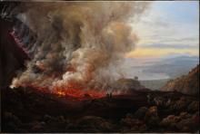 lava and smoke emerging from a dark crater