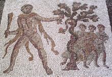 Hercules (left) plucks an apple from a tree (center) with his left hand. He wears his lion skin and carries his club in his right. Three of the Hesperides look on from the background (right).