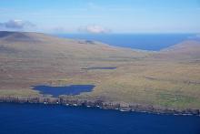 an aerial view of the island of Sandoy, in the Faroes