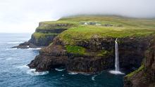 a view of the waterfall and cliffs on Vagar, Faroe Islands