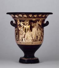 Orestes (foreground center) kneels beside the omphalos in front of a tripod at Delphi, seeking sanctuary from the Furies. Athena (left) and Apollo (right) intervene on his behalf. 